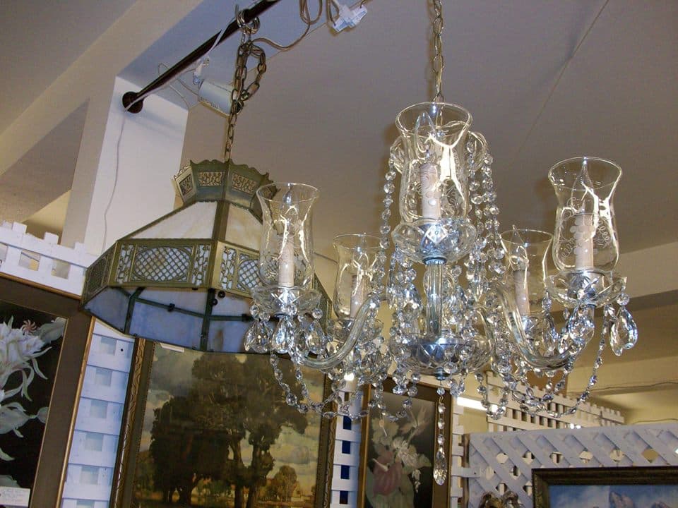 A dense booth display of antiques and vintage home décor of the kind that fills the Harvest Market tables